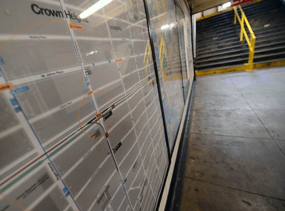 New neighborhood maps designed by Pentagram are centered around the station in which they hang. (Photo via New York City Transit)