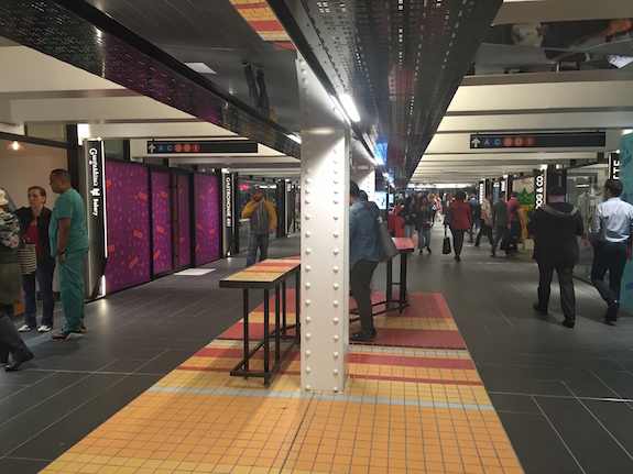Colorful tiles and brighter lights lend TurnStyle a more welcoming air than the typical subway stop. (Photo by Benjamin Kabak)