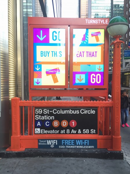 The subway entrances on 57th St. were decked out in orange for TurnStyle's debut. (Photo by Benjamin Kabak)